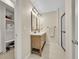 Bathroom featuring double sink vanity, walk-in shower, and walk in closet at 12664 W Virginia Ave, Lakewood, CO 80228