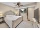 Bright primary bedroom with large window, with stylish decor and an attached TV at 12664 W Virginia Ave, Lakewood, CO 80228