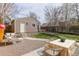 Picturesque backyard featuring an outdoor dining area, lounging spaces, and a garden area bordered by a wooden fence at 2224 N Humboldt St, Denver, CO 80205