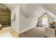 Attic bathroom featuring walk-in shower, slanted ceilings, and a window at 2224 N Humboldt St, Denver, CO 80205