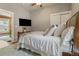 Bedroom with TV, ceiling fan, and a glimpse into another room at 2224 N Humboldt St, Denver, CO 80205