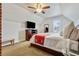 Sloped ceiling bedroom featuring large bed, TV, and a window at 2224 N Humboldt St, Denver, CO 80205