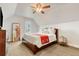 Sloped ceiling bedroom with ceiling fan, accent mirror and a large window at 2224 N Humboldt St, Denver, CO 80205