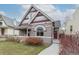 Inviting home showcasing a tidy lawn and striking architectural details and a covered porch at 2224 N Humboldt St, Denver, CO 80205