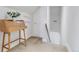 Hallway featuring carpeted floors, a wood desk and white trim at 2224 N Humboldt St, Denver, CO 80205