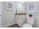 Cozy powder room with decorative mirror and colorful wall art at 2224 N Humboldt St, Denver, CO 80205