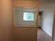 A well-lit bedroom featuring wood-look flooring and large window at 8826 E Florida Ave # 103, Denver, CO 80247