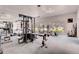 Spacious fitness center with modern equipment, mirrors, and large windows overlooking the outdoors at 8826 E Florida Ave # 103, Denver, CO 80247