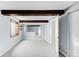 Finished basement featuring beamed ceilings, new carpet, and a small window at 5282 E 116Th Ave, Thornton, CO 80233