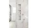 Detailed view of bathroom shower with built in shelving at 5282 E 116Th Ave, Thornton, CO 80233