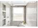 Beautifully tiled bathroom with large window for natural light at 5282 E 116Th Ave, Thornton, CO 80233