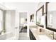 Bathroom showcasing double sinks, granite countertops, and modern design elements at 5282 E 116Th Ave, Thornton, CO 80233