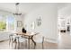 Dining room with modern light fixture, hardwood floors, and stylish decor at 5282 E 116Th Ave, Thornton, CO 80233