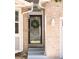 Close up of the front door, showing a decorative wreath and the home's brick facade at 5282 E 116Th Ave, Thornton, CO 80233