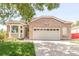 Charming brick home featuring an attached two-car garage, well-maintained lawn, and lovely bay window at 5282 E 116Th Ave, Thornton, CO 80233