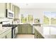 Bright, updated kitchen with granite countertops, stainless steel appliances, and eat-in bar area at 5282 E 116Th Ave, Thornton, CO 80233