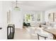Bright living room featuring neutral decor, large windows, and hardwood flooring at 5282 E 116Th Ave, Thornton, CO 80233