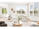 Bright living room featuring a large window, comfortable seating, and stylish decor at 5282 E 116Th Ave, Thornton, CO 80233