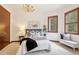 Cozy bedroom with plush carpeting, decorative chandelier, and inviting queen-sized bed with decorative pillows at 6180 E Quincy Ave, Cherry Hills Village, CO 80111