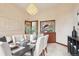 Formal dining room with chandelier and decorative stained glass window at 6180 E Quincy Ave, Cherry Hills Village, CO 80111
