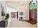 Grand foyer with marble floors, soaring ceilings, and ornate chandelier at 6180 E Quincy Ave, Cherry Hills Village, CO 80111