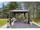Beautiful gazebo with comfortable seating surrounded by trees at 6180 E Quincy Ave, Cherry Hills Village, CO 80111