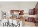 Gourmet kitchen with island seating, professional appliances, and custom cabinetry at 6180 E Quincy Ave, Cherry Hills Village, CO 80111