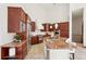 Spacious kitchen with modern appliances, center island, and custom cabinets at 6180 E Quincy Ave, Cherry Hills Village, CO 80111