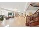 Spacious living area with hardwood floors, comfortable seating, and views of the outdoor landscape at 6180 E Quincy Ave, Cherry Hills Village, CO 80111