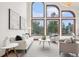 Bright living room featuring soaring ceilings, large windows, and modern furnishings at 6180 E Quincy Ave, Cherry Hills Village, CO 80111