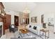 Bright and airy living room with hardwood accents, a fireplace, and neutral decor at 6180 E Quincy Ave, Cherry Hills Village, CO 80111