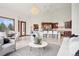 Open concept space that flows from kitchen, dining, and into a comfortable living area at 6180 E Quincy Ave, Cherry Hills Village, CO 80111