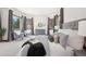 A relaxing bedroom retreat with sitting area and views at 6180 E Quincy Ave, Cherry Hills Village, CO 80111