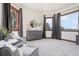 A spacious main bedroom with an adjoining sitting area and large windows at 6180 E Quincy Ave, Cherry Hills Village, CO 80111