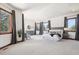 A large main bedroom with sitting area and plenty of natural light at 6180 E Quincy Ave, Cherry Hills Village, CO 80111