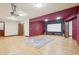 Large theater room with hardwood floors, a projector screen, and surround sound speakers at 6180 E Quincy Ave, Cherry Hills Village, CO 80111