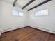 Bright bedroom with hardwood floors and two windows at 4348 S Jason St, Englewood, CO 80110