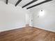 Bright bedroom with hardwood floors and access to another room at 4348 S Jason St, Englewood, CO 80110