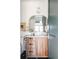 Cozy bathroom with wood vanity, marble countertop, and modern decor at 1641 S Corona St, Denver, CO 80210