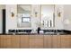 Elegant bathroom with double vanity, marble countertops, gold accents, and modern lighting at 1641 S Corona St, Denver, CO 80210