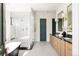 Luxurious bathroom features a walk-in shower, freestanding tub, double vanity, and designer finishes at 1641 S Corona St, Denver, CO 80210