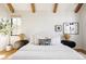 Stylish bedroom with white linens, modern decor, and hardwood floors at 1641 S Corona St, Denver, CO 80210
