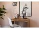 Close up of a rattan desk with decorations and artwork at 1641 S Corona St, Denver, CO 80210