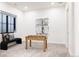 Bright game room featuring a foosball table and a cozy window bench with stylish pillows at 1641 S Corona St, Denver, CO 80210