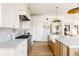 Well-appointed kitchen with marble countertops, stainless steel appliances, custom cabinets, and an eat-in kitchen island at 1641 S Corona St, Denver, CO 80210