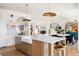 Open-concept kitchen with a large island, breakfast bar, and modern appliances, great for entertaining guests at 1641 S Corona St, Denver, CO 80210