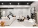 Finished basement with a large white sectional, fireplace, and stylish decor at 1641 S Corona St, Denver, CO 80210