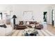 Comfortable living room with a plush sofa, stylish decor, and a view into the modern kitchen at 1641 S Corona St, Denver, CO 80210