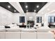 Finished basement with a large white sectional and stylish decor at 1641 S Corona St, Denver, CO 80210