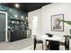 Basement featuring wet bar with blue tiled accent wall at 1641 S Corona St, Denver, CO 80210